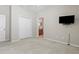 Bedroom includes a closet, ceiling fan, television, carpeted floors and an ensuite bath at 11716 Summer Springs Dr, Riverview, FL 33579