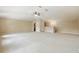 Spacious bonus room with neutral carpeting, ceiling fan, and great natural light at 11716 Summer Springs Dr, Riverview, FL 33579