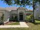Inviting front entrance with well-maintained landscaping and a charming walkway at 11716 Summer Springs Dr, Riverview, FL 33579