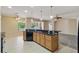 Well-lit kitchen featuring stainless steel appliances, granite countertops, and an eat-in breakfast bar at 11716 Summer Springs Dr, Riverview, FL 33579