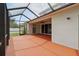 Enclosed patio with ceiling fan, concrete flooring, and sliding door entrance into home at 11716 Summer Springs Dr, Riverview, FL 33579