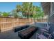 Backyard with a garden space, featuring raised planters and a seating area, perfect for relaxation and outdoor activities at 121 W Mohawk Ave, Tampa, FL 33604