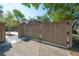 Enclosed backyard with a private wooden fence and gate that adds security and seclusion to the property at 121 W Mohawk Ave, Tampa, FL 33604