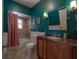 Bathroom boasts stylish vanity with granite countertop, modern fixtures, and tub/shower combo at 121 W Mohawk Ave, Tampa, FL 33604