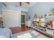 Bedroom with hardwood floors and closet with sliding doors, ample built-in storage at 121 W Mohawk Ave, Tampa, FL 33604