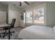 Relaxing bedroom with hardwood floors, bright window, and closet with sliding doors at 121 W Mohawk Ave, Tampa, FL 33604