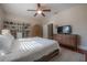 Bright and spacious bedroom featuring a ceiling fan, built-in bookshelves, and ample natural light at 121 W Mohawk Ave, Tampa, FL 33604
