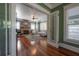 Charming dining room with hardwood floors, open doorway and a view into the living room at 121 W Mohawk Ave, Tampa, FL 33604