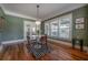 Stylish dining room with hardwood floors, plenty of natural light, and a modern table, ideal for intimate dining at 121 W Mohawk Ave, Tampa, FL 33604