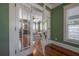 Inviting dining room with hardwood floors, ample windows, and a round table, creating an ideal space for meals at 121 W Mohawk Ave, Tampa, FL 33604