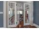 Elegant dining room with a round table, hardwood floors, and natural light, ideal for intimate gatherings at 121 W Mohawk Ave, Tampa, FL 33604