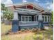 Beautifully renovated craftsman home with a charming porch and manicured landscaping at 121 W Mohawk Ave, Tampa, FL 33604