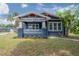 Charming craftsman home featuring a lovely front porch and beautifully landscaped yard at 121 W Mohawk Ave, Tampa, FL 33604