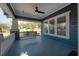 Relax on the porch swing of this home featuring a ceiling fan and beautiful views of the neighborhood at 121 W Mohawk Ave, Tampa, FL 33604