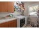 Clean laundry room with modern washer and dryer and ample storage space at 121 W Mohawk Ave, Tampa, FL 33604