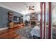 Elegant living room with hardwood floors, a brick fireplace, and stylish furnishings for comfortable living at 121 W Mohawk Ave, Tampa, FL 33604
