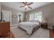 Cozy main bedroom featuring a ceiling fan, a decorative rug and natural light at 121 W Mohawk Ave, Tampa, FL 33604