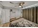 Cozy bedroom featuring a ceiling fan and neutral colors at 131 Oak Park Ave, Brooksville, FL 34601