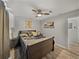 Bedroom with hardwood floors, ceiling fan, and decorative pillows at 131 Oak Park Ave, Brooksville, FL 34601