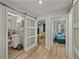 Hallway with barn door bathroom and view of living room area at 131 Oak Park Ave, Brooksville, FL 34601