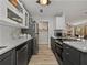 Galley kitchen with stainless steel appliances and view to the living area at 131 Oak Park Ave, Brooksville, FL 34601