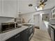 Modern kitchen featuring stainless appliances, modern cabinets, and plenty of counter space at 131 Oak Park Ave, Brooksville, FL 34601
