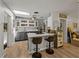 Kitchen featuring an island with bar seating, modern appliances, and plenty of natural light at 131 Oak Park Ave, Brooksville, FL 34601