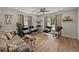 Spacious living room with hardwood floors, contemporary furniture, and bright lighting at 131 Oak Park Ave, Brooksville, FL 34601