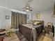 Cozy main bedroom with soft decor, ceiling fan and a neutral color palette at 131 Oak Park Ave, Brooksville, FL 34601