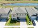 Aerial view of the home showcases its location near a pond and well-maintained landscaping at 14623 Horse Trot Rd, Lithia, FL 33547