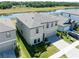The aerial view displays the property's backyard and neighborhood, near the beautiful lake at 14623 Horse Trot Rd, Lithia, FL 33547