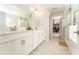 Beautiful bathroom with double sink vanity and glass shower at 14623 Horse Trot Rd, Lithia, FL 33547