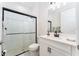 Modern bathroom with white vanity, glass-enclosed shower, and contemporary fixtures for a spa-like experience at 14623 Horse Trot Rd, Lithia, FL 33547