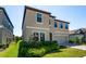 Exterior of the house with well-maintained lawn and front yard landscaping and a two car garage at 14623 Horse Trot Rd, Lithia, FL 33547