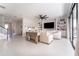 Spacious living room boasts tile flooring, built-in shelving, and seamless access to an outdoor living space at 14623 Horse Trot Rd, Lithia, FL 33547