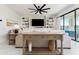 Bright living room features a comfortable sofa, stylish console table, and glass doors with an inviting outdoor view at 14623 Horse Trot Rd, Lithia, FL 33547