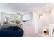 Bright living room with large sectional sofa, ceiling fan, built-in shelving and projector with a blank screen at 14623 Horse Trot Rd, Lithia, FL 33547