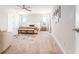 Bright main bedroom with a large bed, bench and decor at 14623 Horse Trot Rd, Lithia, FL 33547