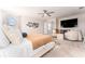 Spacious main bedroom with a large bed and seating area with TV at 14623 Horse Trot Rd, Lithia, FL 33547