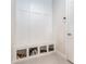Mudroom with built-in bench and cubbies, ideal for organizing shoes and bags by the entryway at 14623 Horse Trot Rd, Lithia, FL 33547