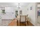 Dining area featuring a table with seating for four, adjacent to the updated kitchen at 15034 Newport Rd, Clearwater, FL 33764