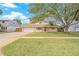 Charming home with a large, mature tree in the front yard and an inviting curb appeal at 15034 Newport Rd, Clearwater, FL 33764
