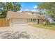 Charming two-story home with a spacious driveway and attached garage at 15034 Newport Rd, Clearwater, FL 33764