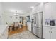 Spacious kitchen with stainless steel refrigerator and ample white cabinetry at 15034 Newport Rd, Clearwater, FL 33764