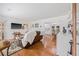 Open concept living space with hardwood floors flowing into the dining area and kitchen at 15034 Newport Rd, Clearwater, FL 33764