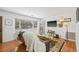 Bright living room with hardwood floors, a large window, and comfortable seating at 15034 Newport Rd, Clearwater, FL 33764