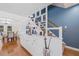 Bright living room featuring hardwood floors, custom built-ins and staircase at 15034 Newport Rd, Clearwater, FL 33764