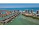 Sweeping aerial view of a waterfront community with a canal, boats, and picturesque ocean views at 1581 Gulf Blvd # 301N, Clearwater Beach, FL 33767