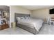 Bedroom featuring carpet flooring, a bed with a gray headboard, and a workspace at 1581 Gulf Blvd # 301N, Clearwater Beach, FL 33767