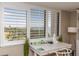 Bright interior featuring a desk, coastal accents, and natural light streaming through large windows at 1581 Gulf Blvd # 301N, Clearwater Beach, FL 33767